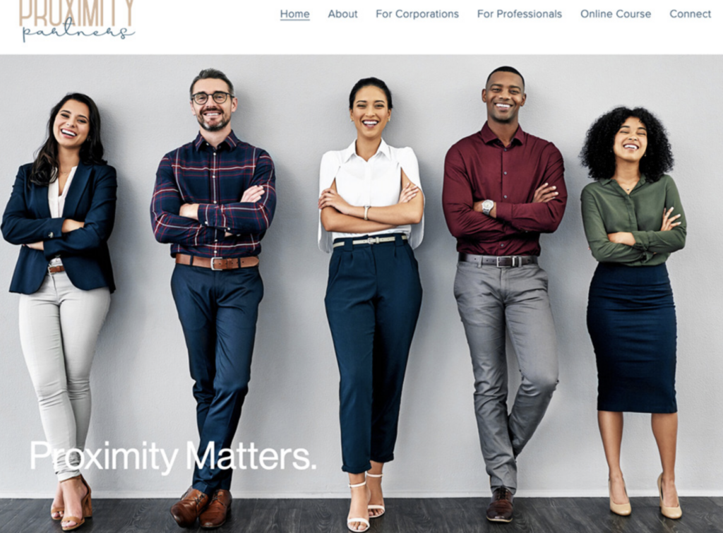 Group of business people dressed up standing in a line smiling